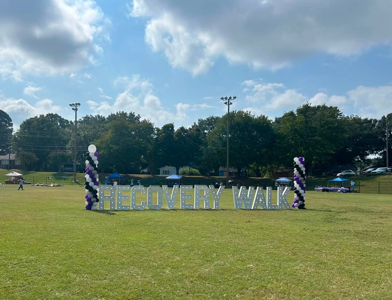 Community members gathering at a North Carolina recovery walk